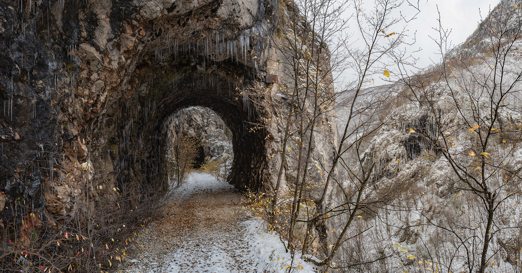 Tunnel in the gorge of the river Miljacka on the abandoned railway track from Sarajevo to Pale. © Tobias Strahl